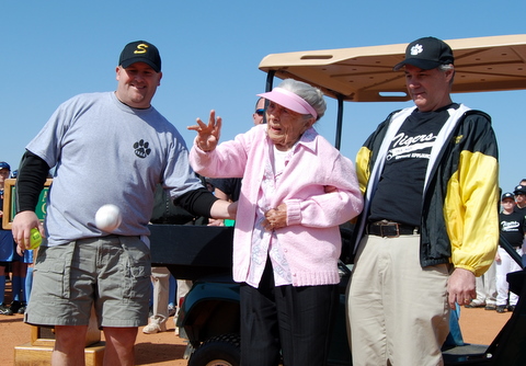 Dan assisting Mrs. Bowie at the dedication of the Parker Bowie Athletic Complex